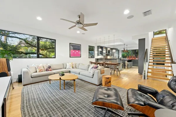 a living room with furniture or couch and a large window