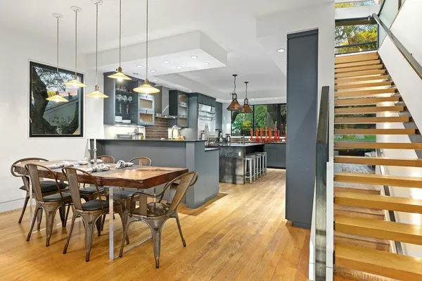 a dining room with furniture and wooden floor