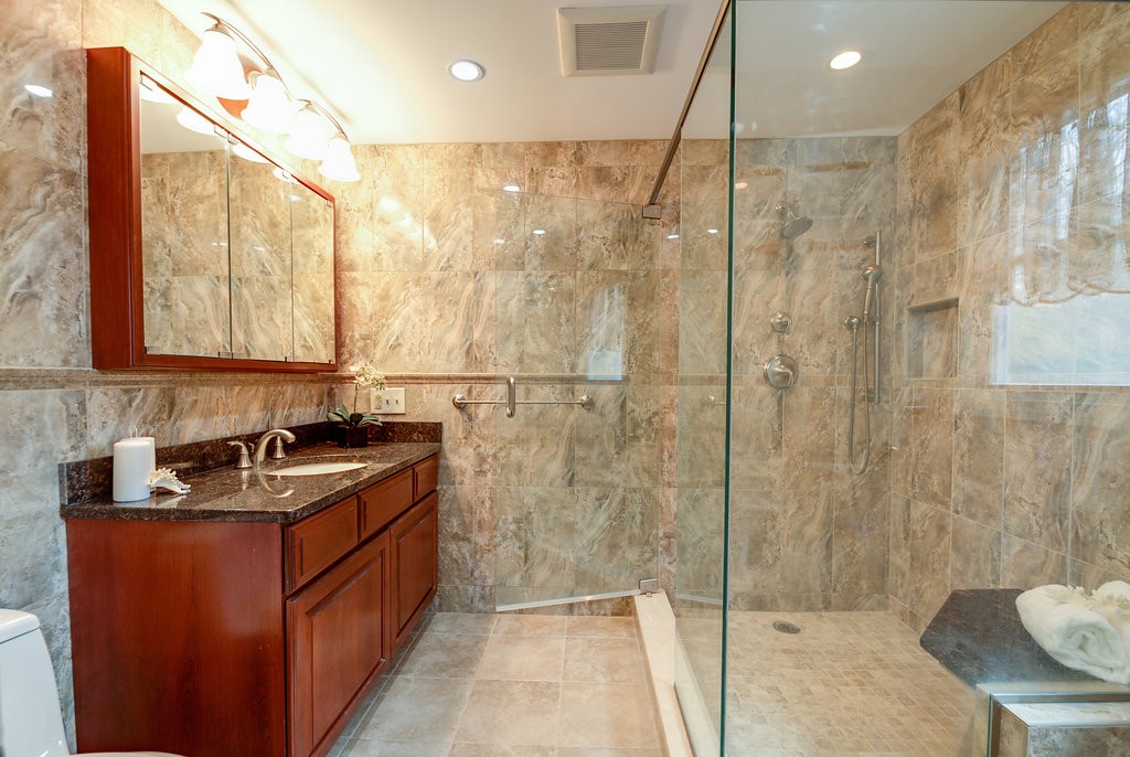 60 Woodcrest Road Boxford, MA 01921 - Photo 11 of 23 a bathroom with a sink a toilet and shower