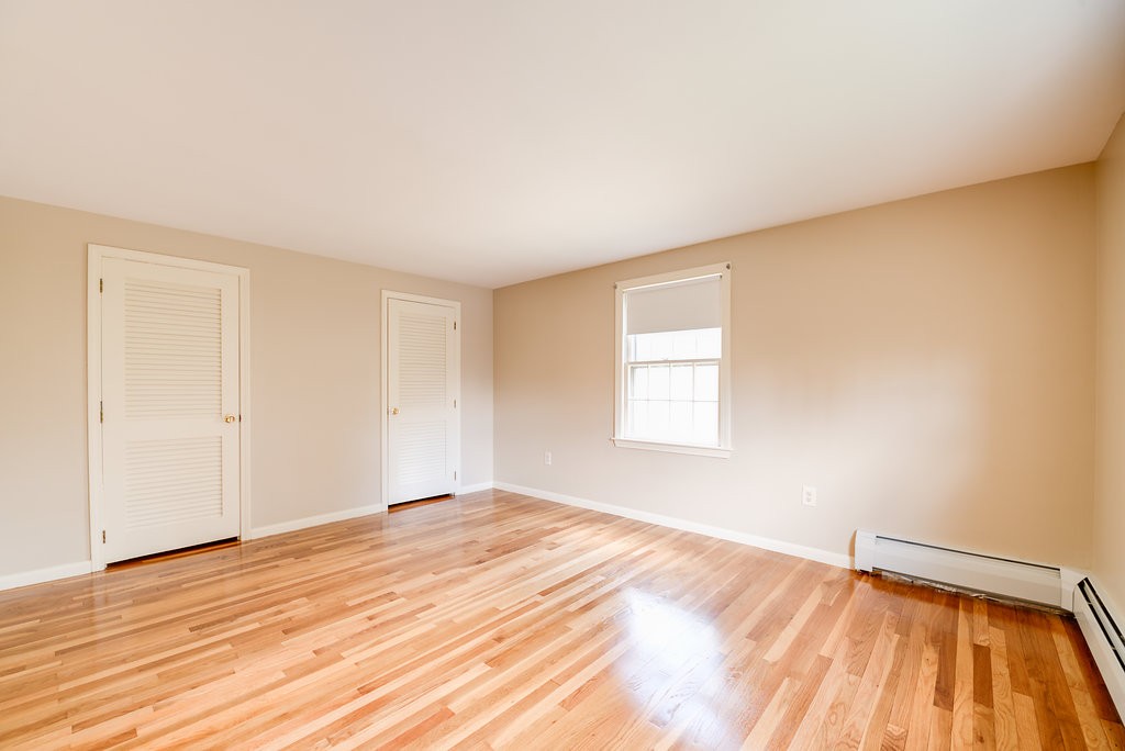 60 Woodcrest Road Boxford, MA 01921 - Photo 15 of 23 a view of an empty room with wooden floor and a window