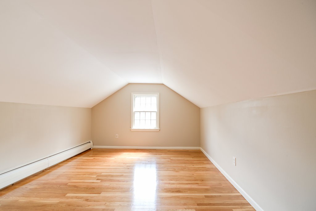 60 Woodcrest Road Boxford, MA 01921 - Photo 16 of 23 a view of an empty room with wooden floor and a window