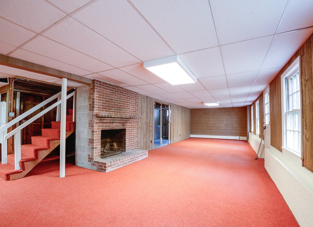 60 Woodcrest Road Boxford, MA 01921 - Photo 18 of 23 a view of an empty room with a fireplace
