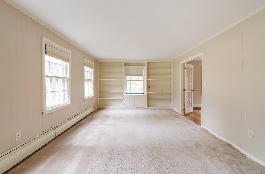 60 Woodcrest Road Boxford, MA 01921 - Photo 7 of 23 an empty room with windows