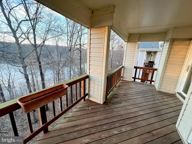 a view of deck with wooden floor and outdoor seating