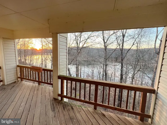 a view of balcony with wooden floor