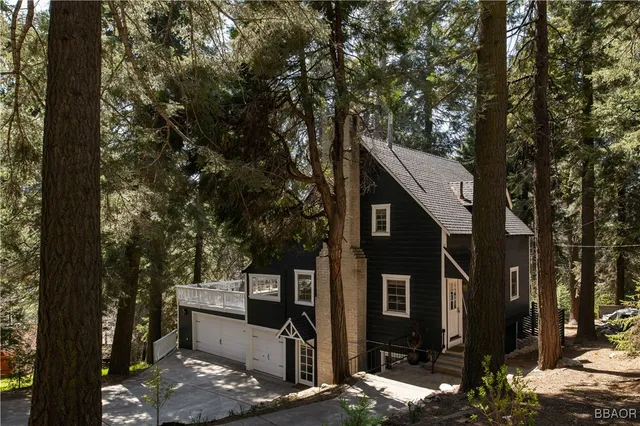 a view of a house with a tree