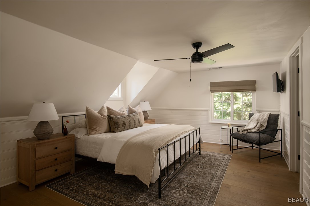 920 Oak Road Lake Arrowhead, CA 92385 - Photo 14 of 28 a bedroom with bed and a window