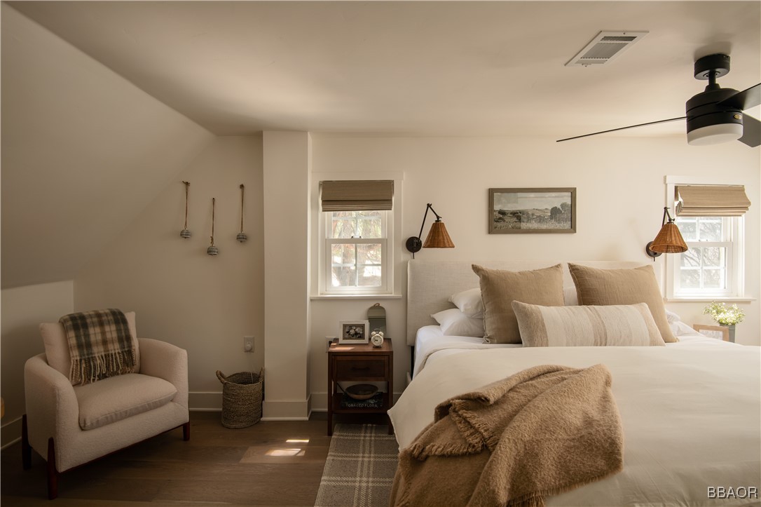 920 Oak Road Lake Arrowhead, CA 92385 - Photo 16 of 28 a bedroom with a bed and a couch