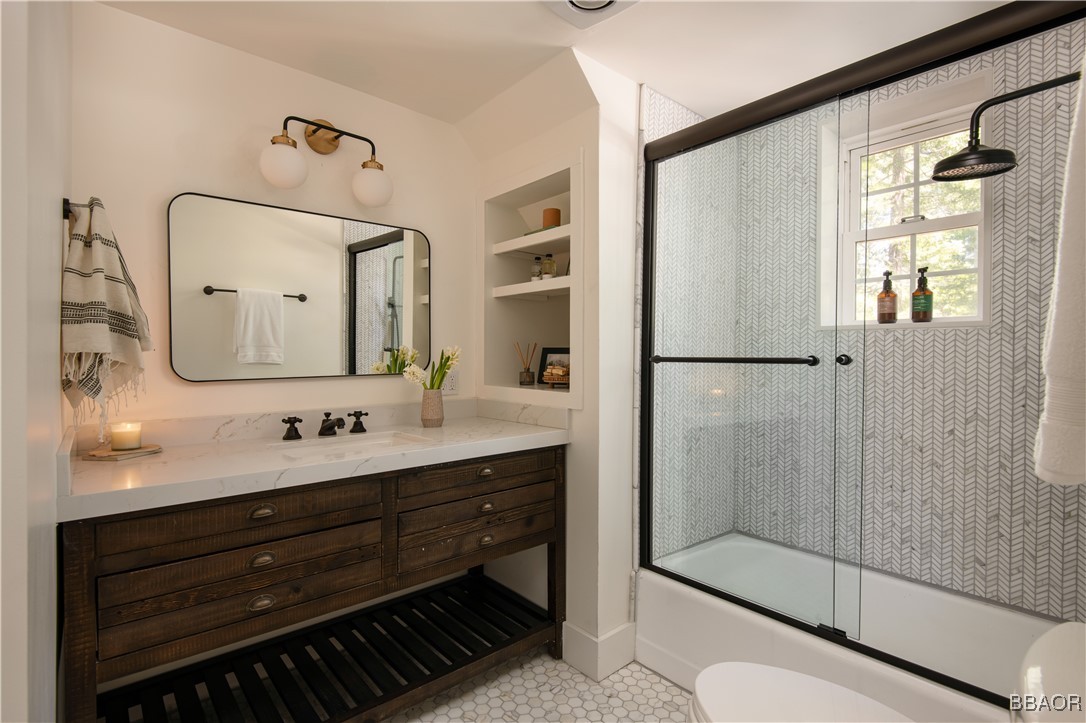 920 Oak Road Lake Arrowhead, CA 92385 - Photo 18 of 28 a bathroom with a double vanity sink mirror and shower