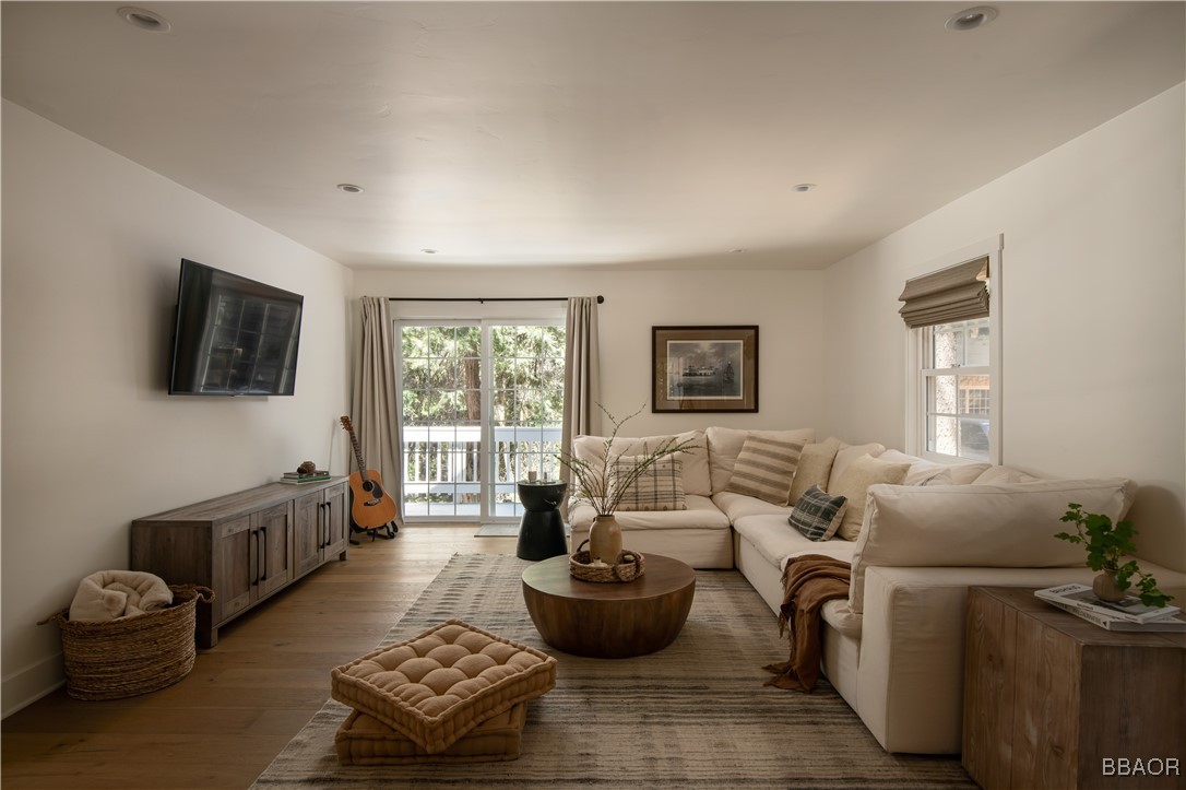920 Oak Road Lake Arrowhead, CA 92385 - Photo 4 of 28 a living room with furniture and a flat screen tv
