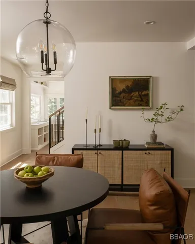 a dining room with furniture and window