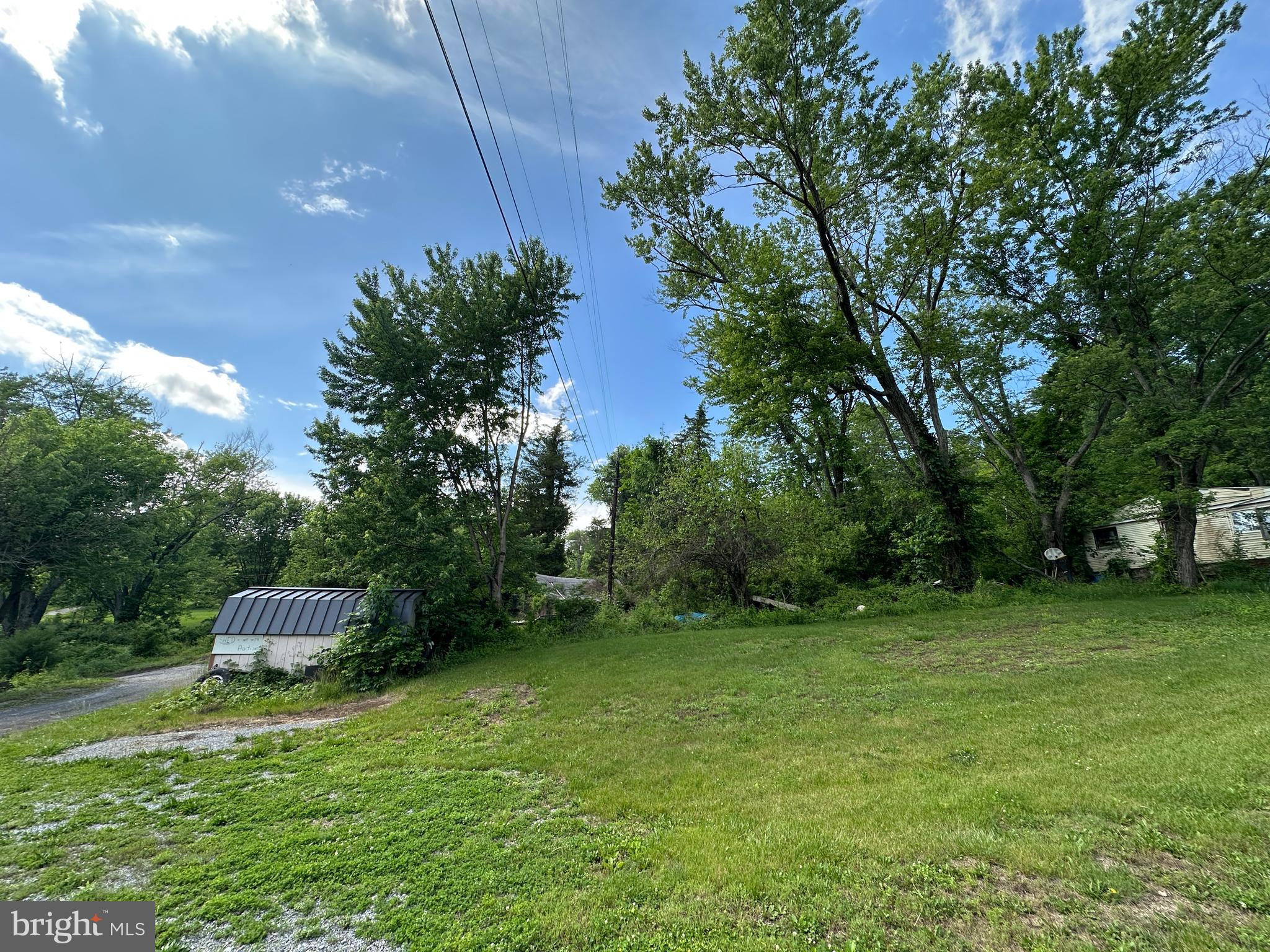 13726 Hopps Landing Road Hagerstown, MD 21740 - Photo 54 of 71 a backyard of a house with lots of green space