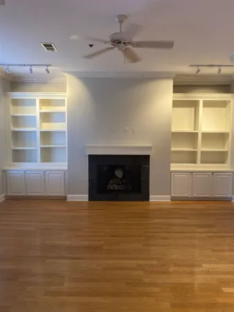 a view of empty room with a fireplace
