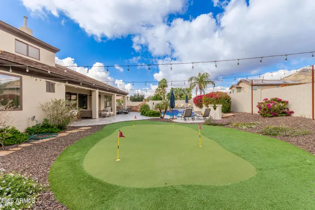 a view of a house with a street