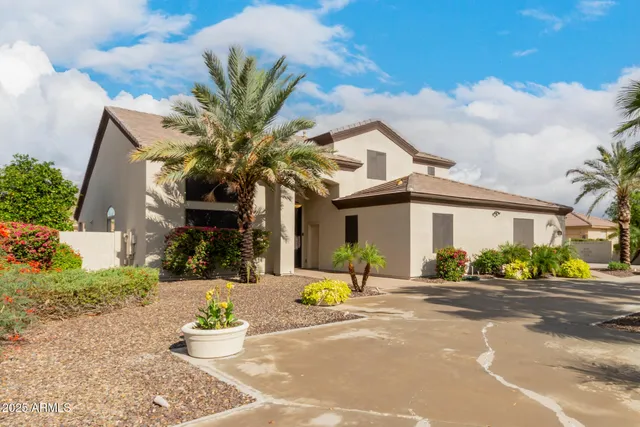 a lobby with furniture and a chandelier