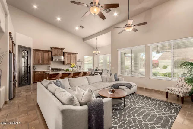 a spacious bathroom with a tub a sink and mirror