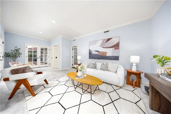 a living room with furniture and a rug