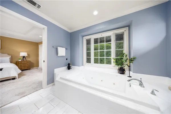 a bathroom with a bathtub and a sink