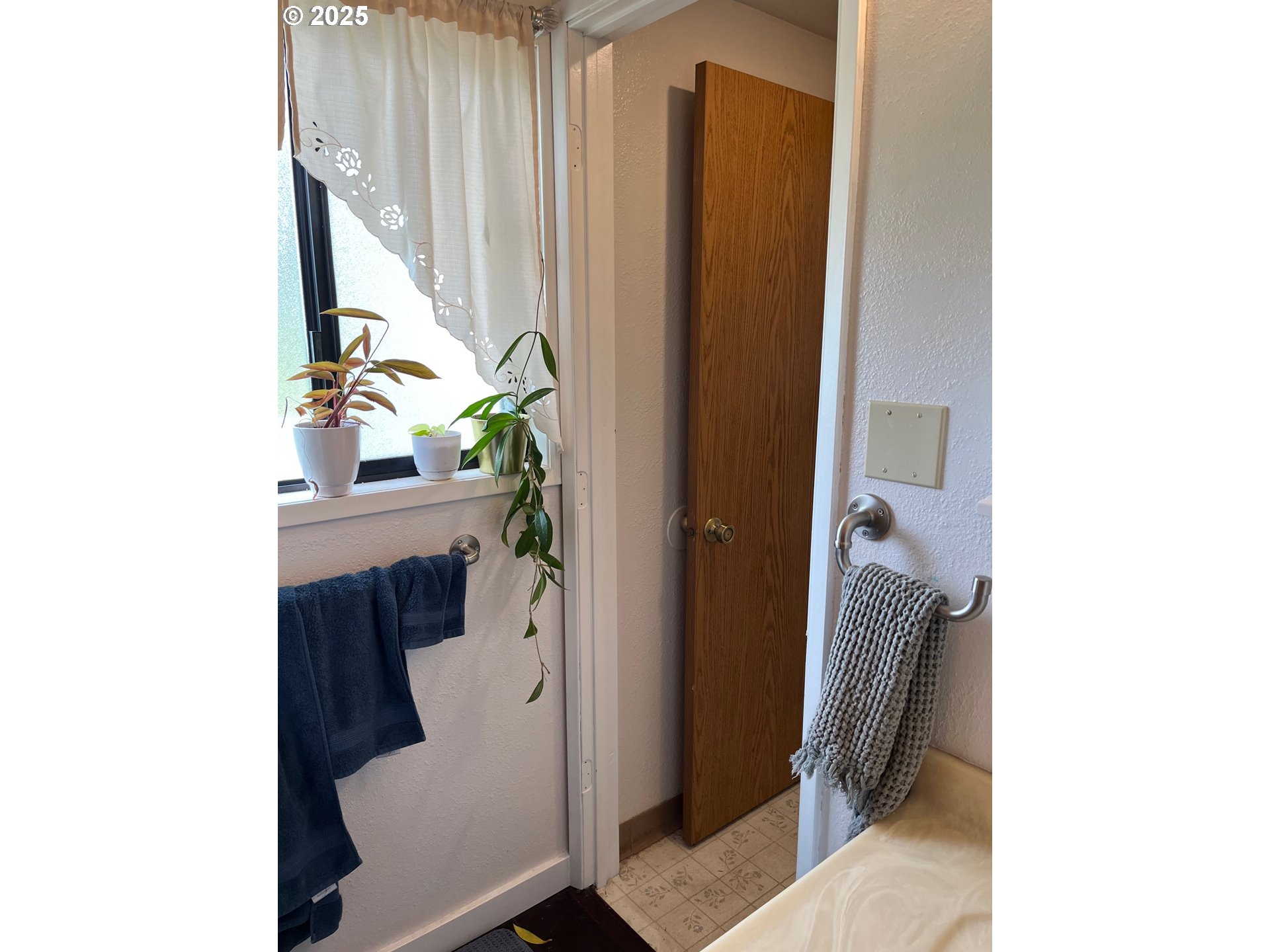 1205 49th Street Seaview, WA 98644 - Photo 14 of 36 a living room with furniture and a window