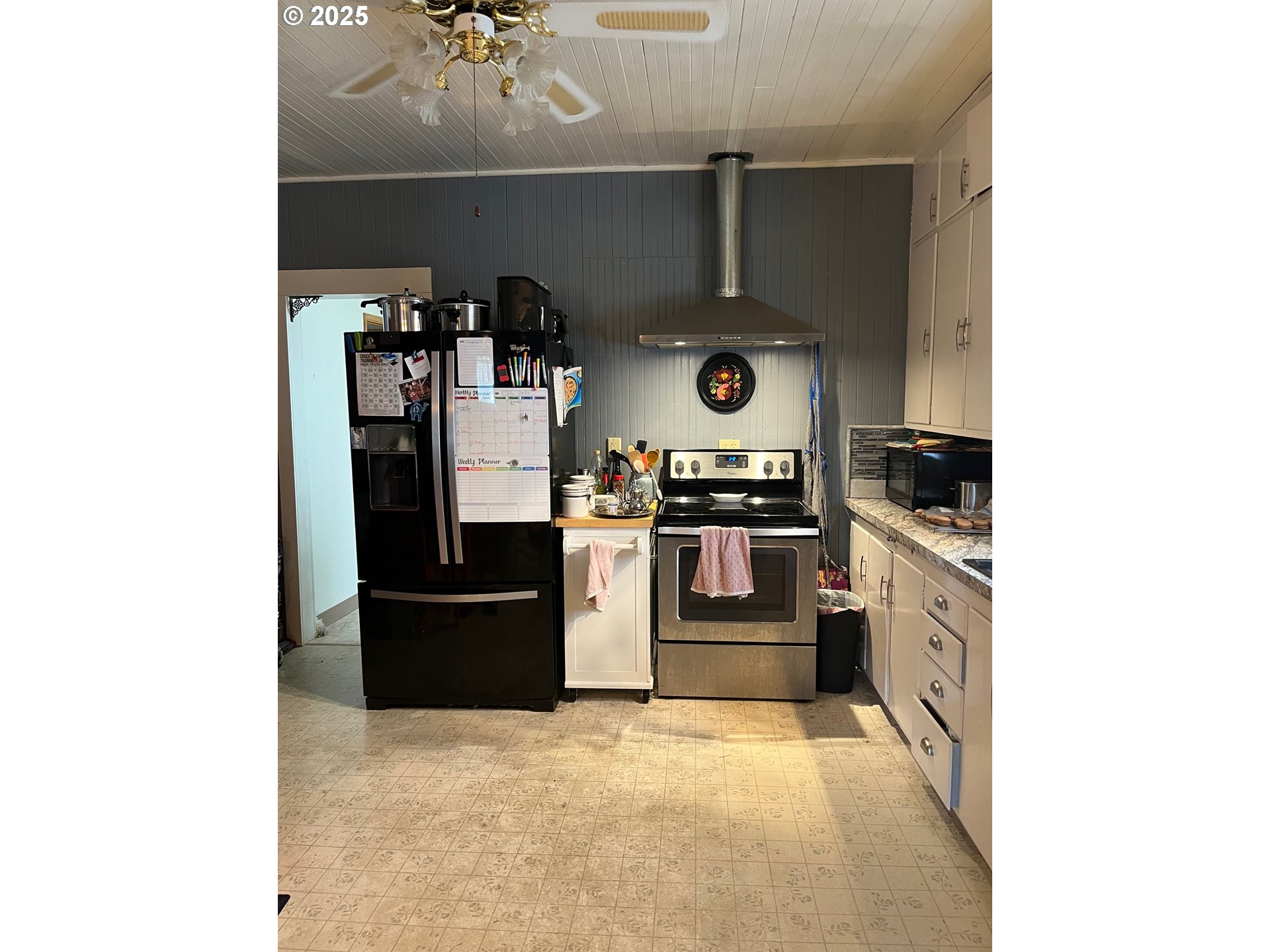1205 49th Street Seaview, WA 98644 - Photo 16 of 36 a kitchen with a refrigerator and a stove