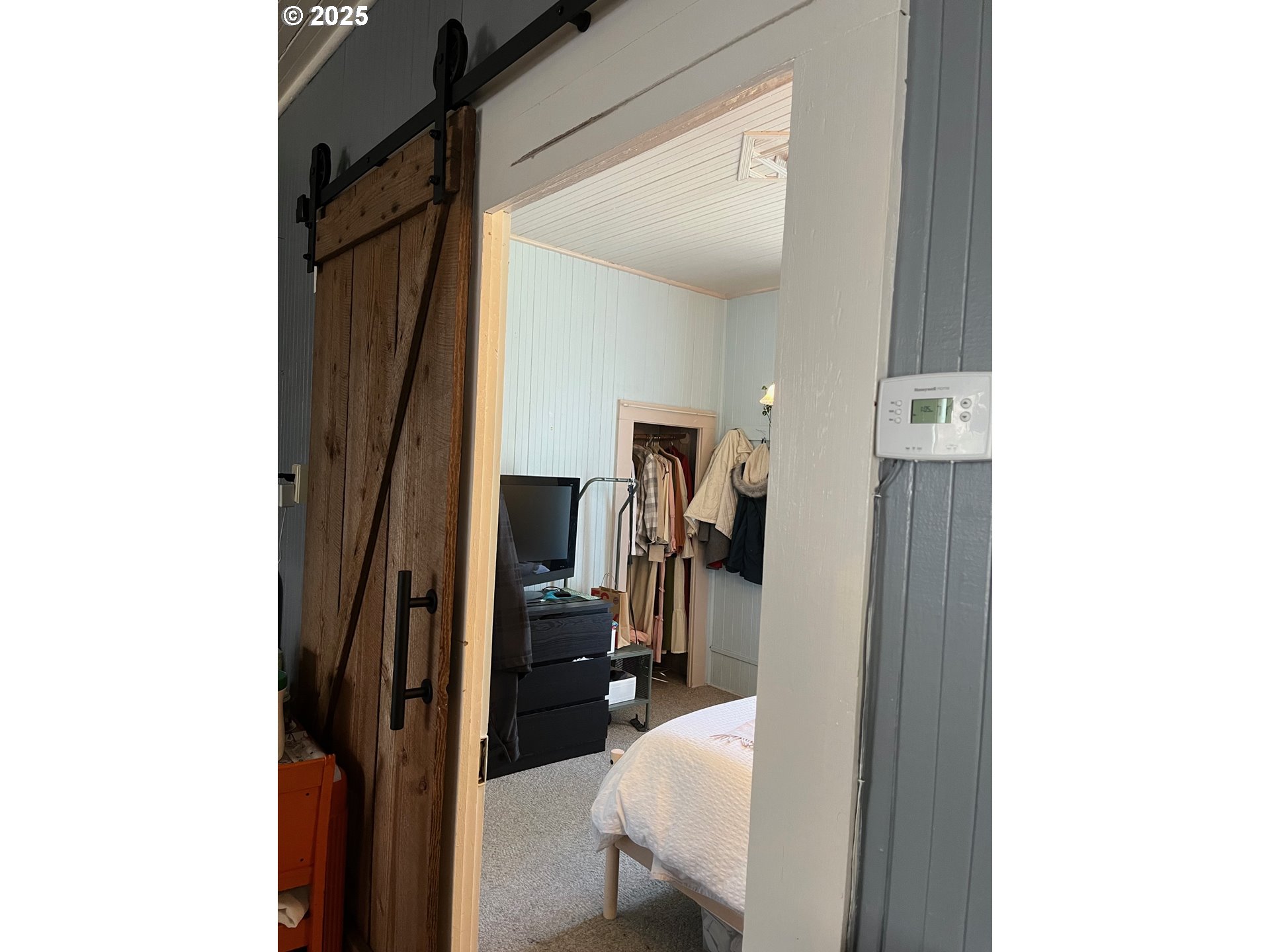 1205 49th Street Seaview, WA 98644 - Photo 17 of 36 a view of a hallway with a room and a car parked