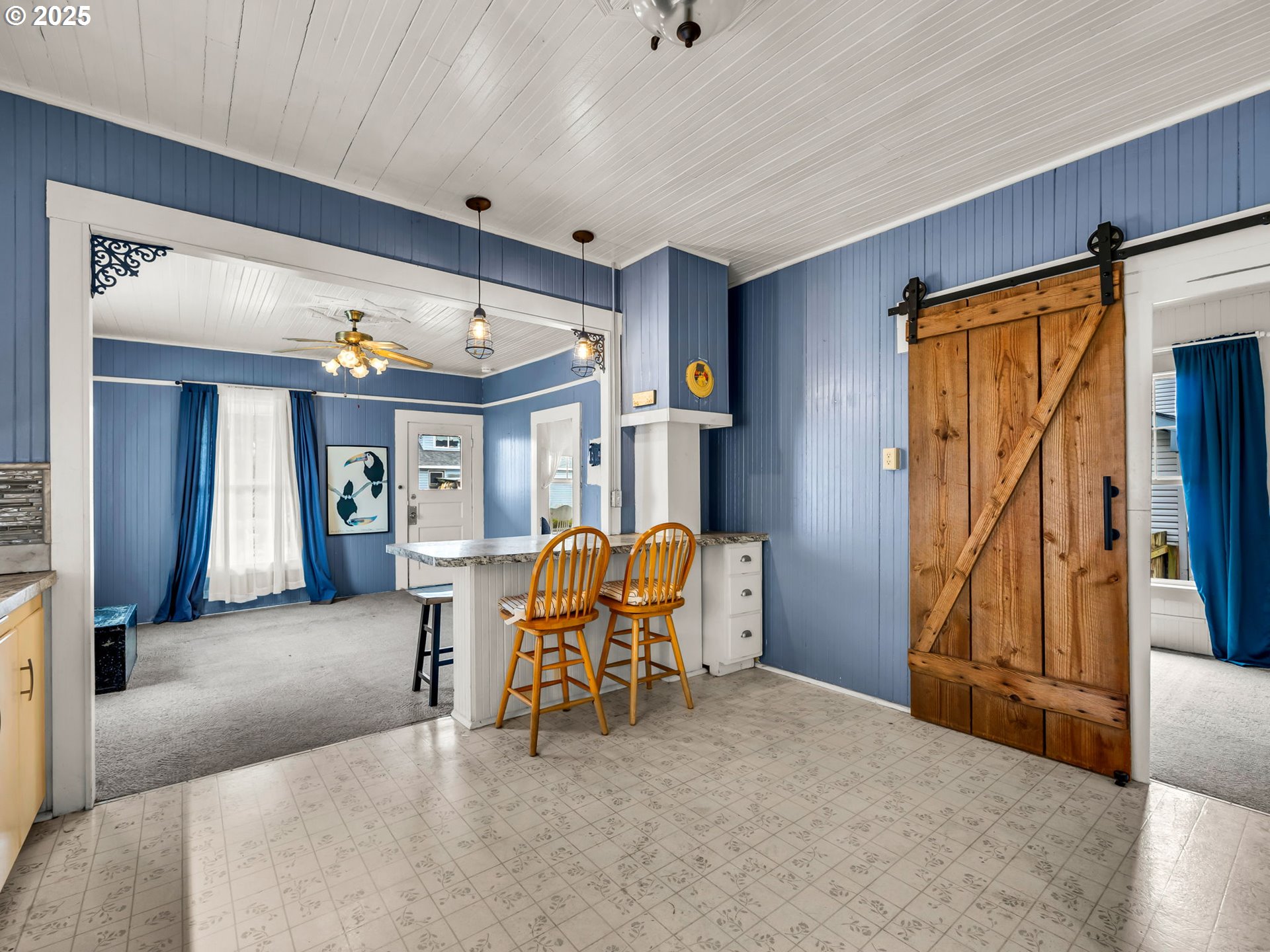 1205 49th Street Seaview, WA 98644 - Photo 24 of 36 a view of a livingroom with furniture and a hallway