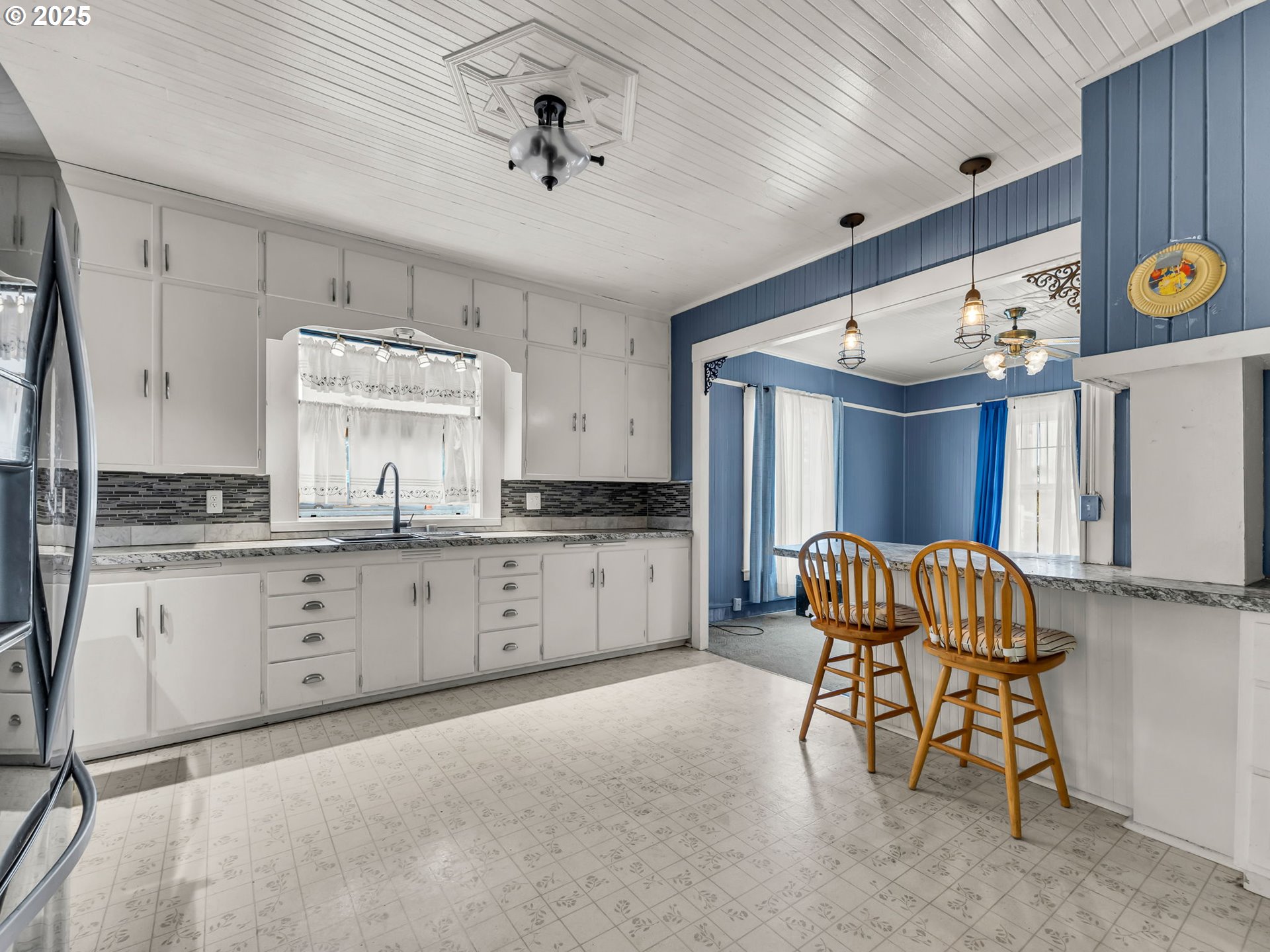 1205 49th Street Seaview, WA 98644 - Photo 26 of 36 a kitchen with furniture and windows