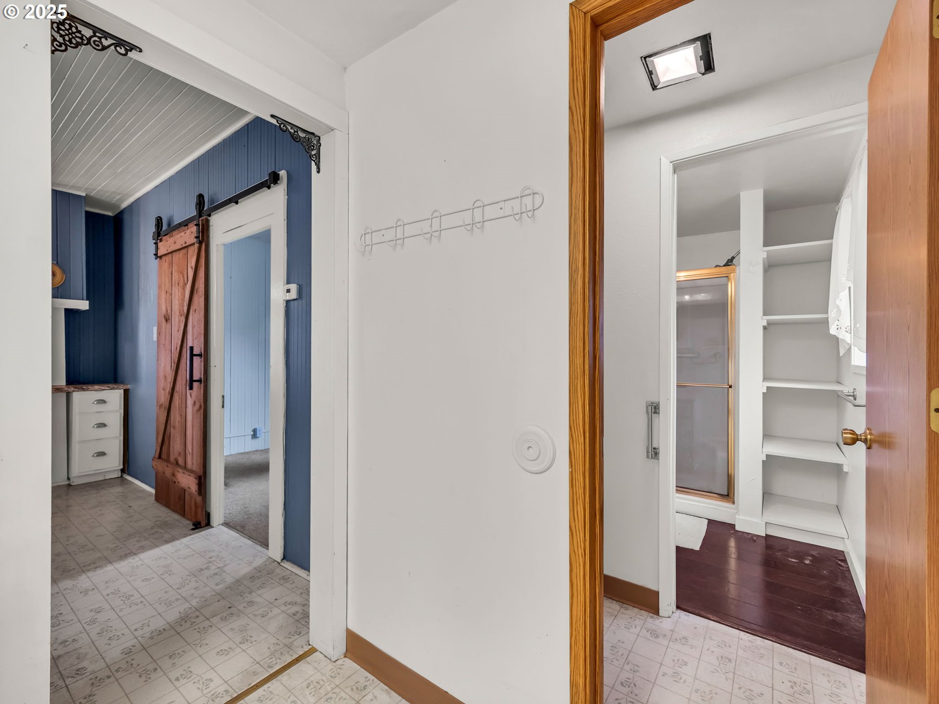 1205 49th Street Seaview, WA 98644 - Photo 30 of 36 a view of a hallway with wooden floor and closet
