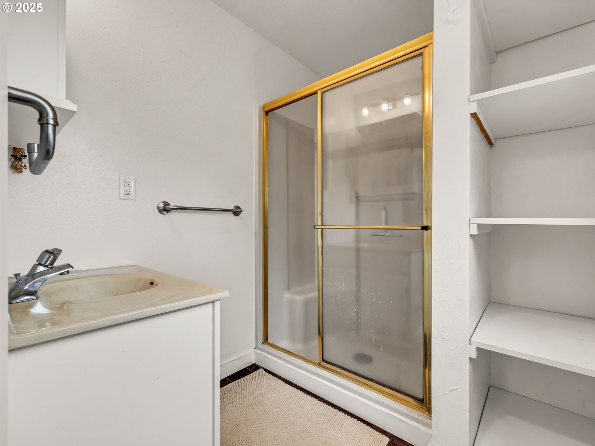 1205 49th Street Seaview, WA 98644 - Photo 31 of 36 a bathroom with a shower and sink