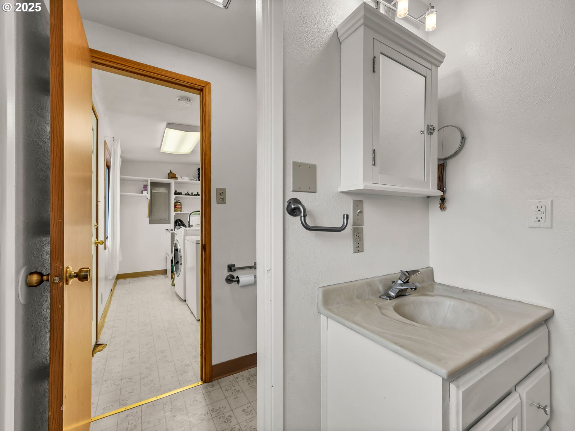 1205 49th Street Seaview, WA 98644 - Photo 32 of 36 a bathroom with a sink and mirror
