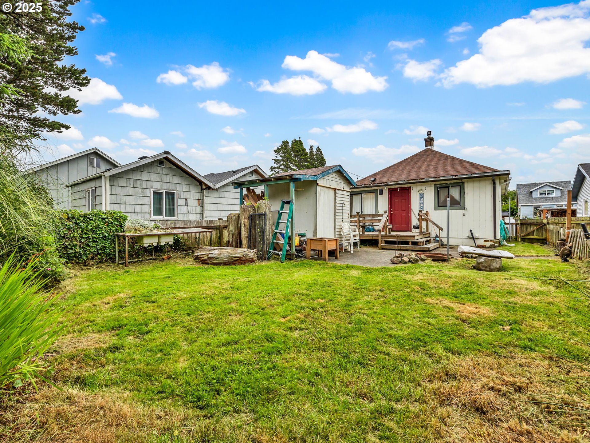 1205 49th Street Seaview, WA 98644 - Photo 36 of 36 a front view of a house with a yard
