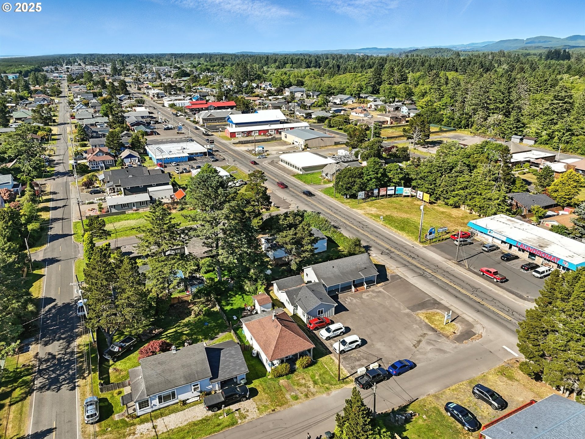 1205 49th Street Seaview, WA 98644 - Photo 4 of 36 an aerial view of residential houses with outdoor space