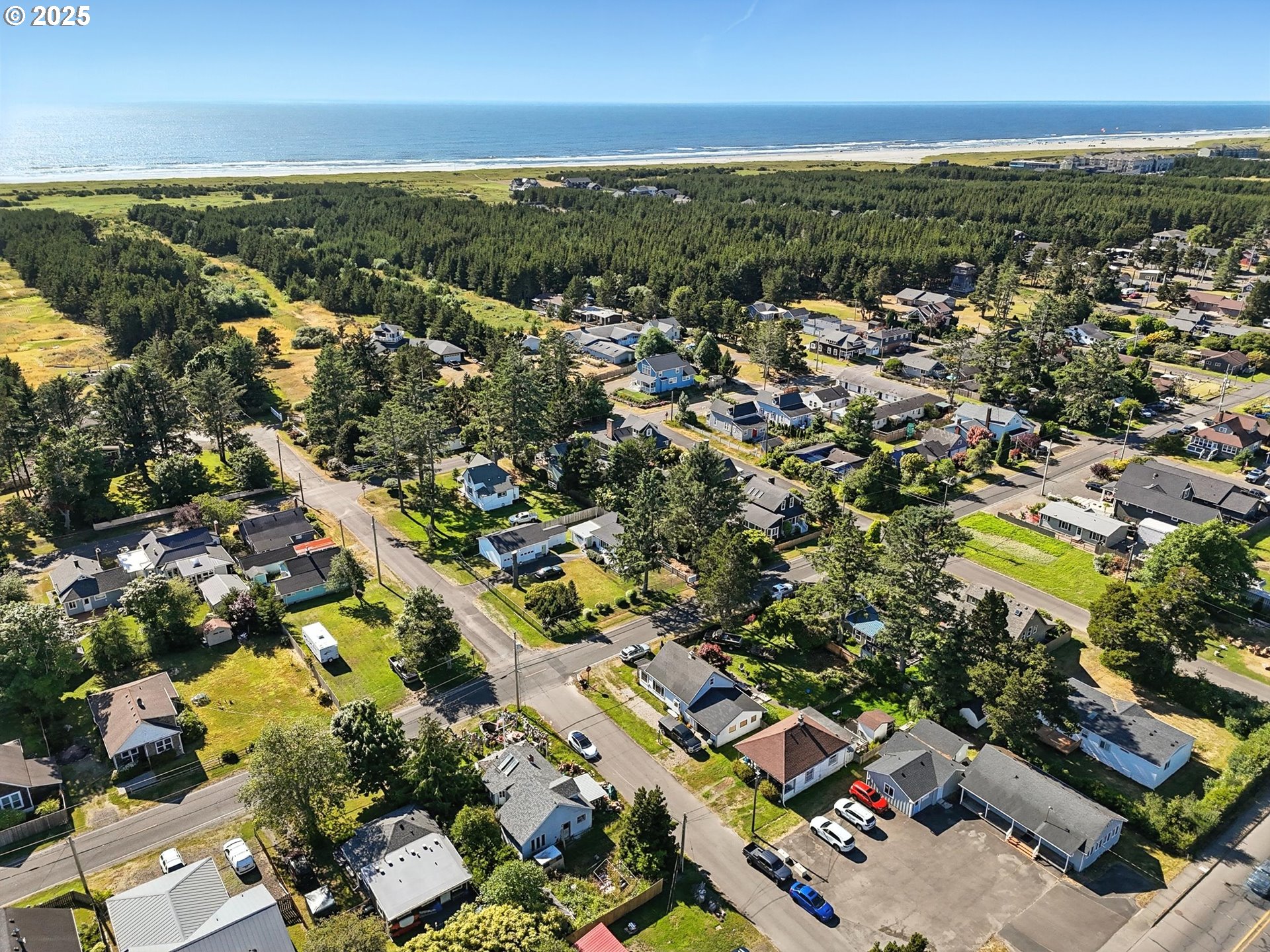 1205 49th Street Seaview, WA 98644 - Photo 5 of 36 an aerial view of residential houses with outdoor space