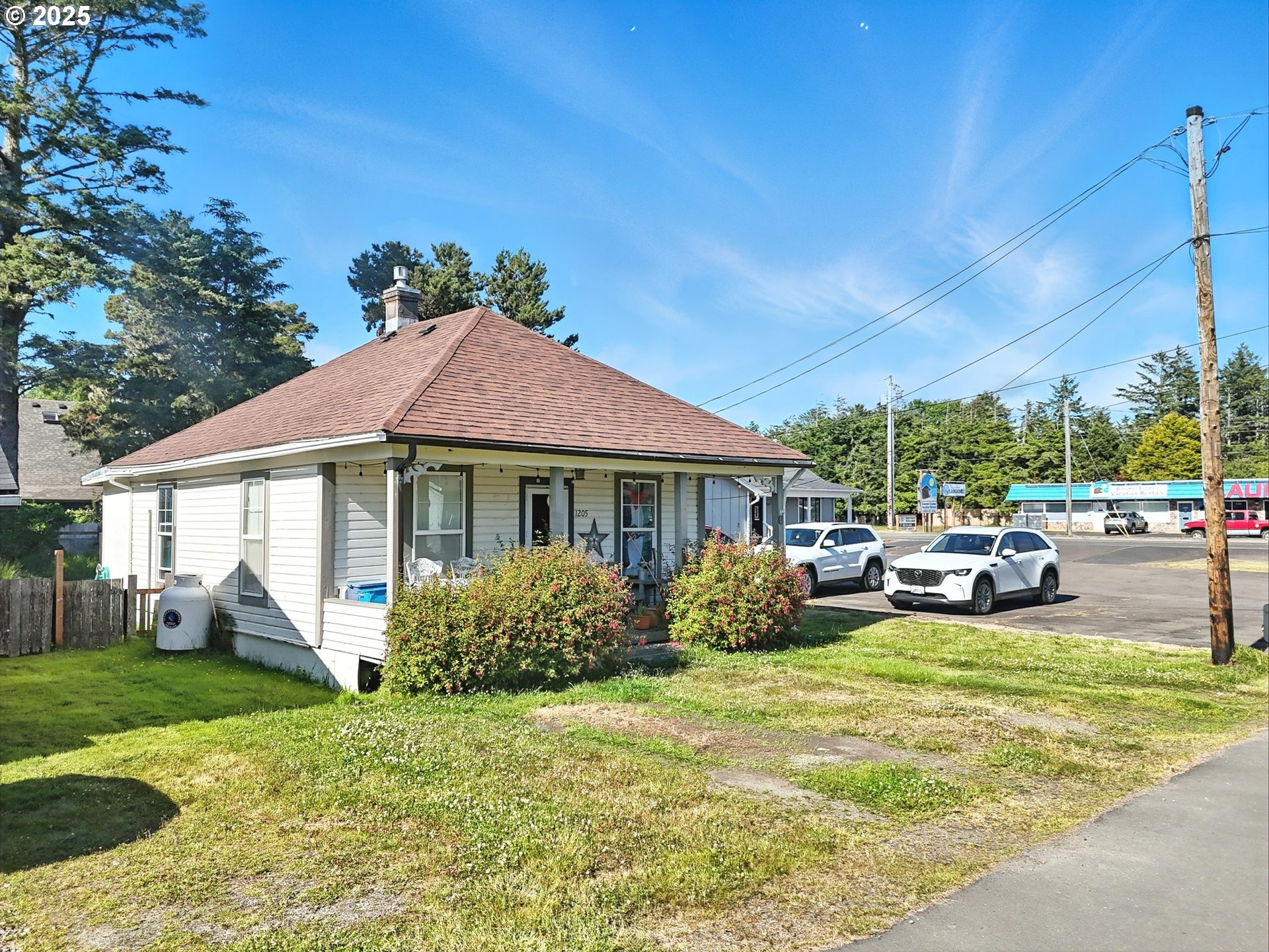 1205 49th Street Seaview, WA 98644 - Photo 10 of 36 a view of a house with a garden