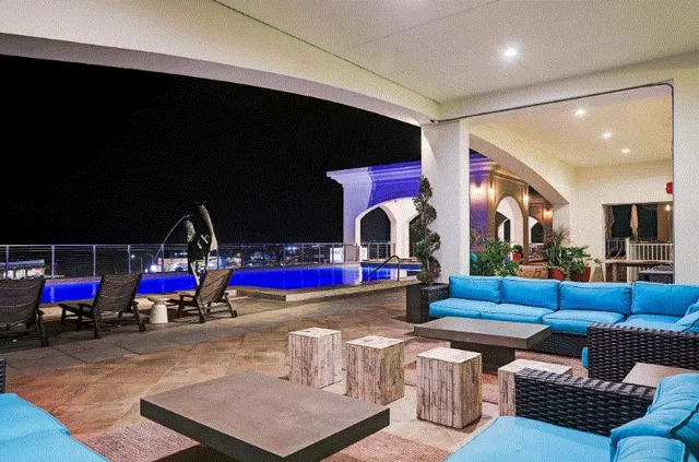 a living room with lots of furniture and a flat screen tv