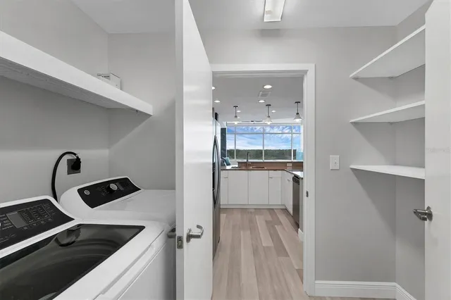a kitchen with a refrigerator and a sink