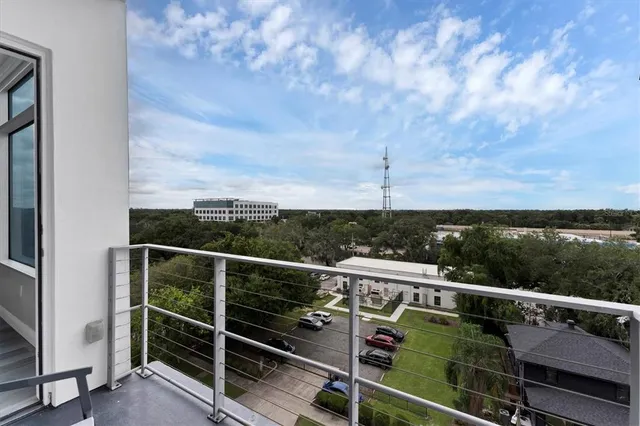 a view of a balcony with chairs