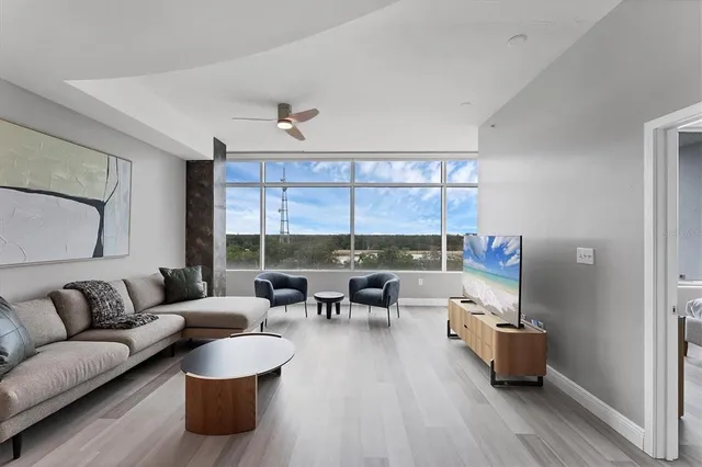 a living room with furniture and a large window