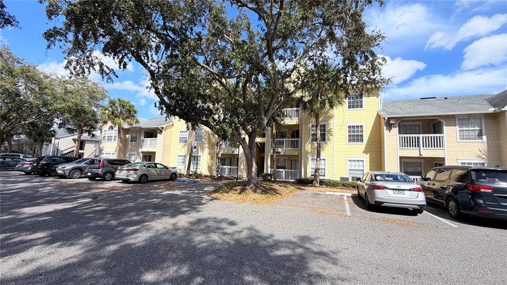 1037 South Hiawassee Road, Unit 2825 Orlando, FL 32835 - Photo 16 of 16 a view of a cars parked in front of a building