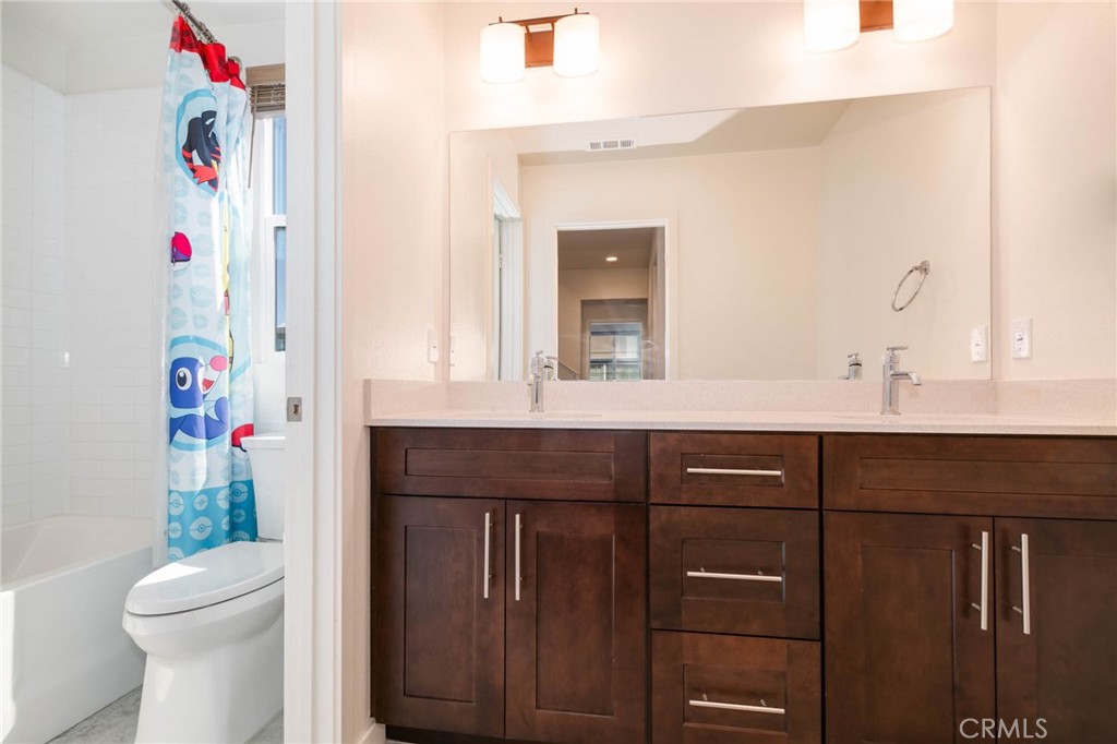 580 Cultivate Irvine, CA 92618 - Photo 17 of 30 a bathroom with a sink vanity and a toilet