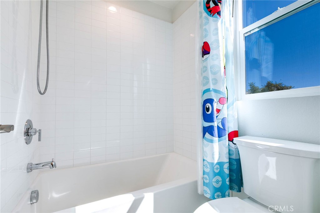 580 Cultivate Irvine, CA 92618 - Photo 20 of 30 a bathroom with a shower toilet and a bathtub