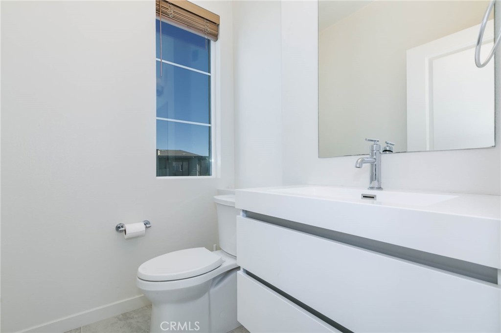 580 Cultivate Irvine, CA 92618 - Photo 21 of 30 a bathroom with a sink a toilet and mirror
