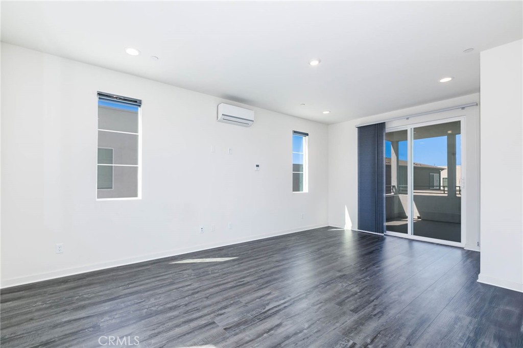 580 Cultivate Irvine, CA 92618 - Photo 25 of 30 a view of an empty room with wooden floor and a window
