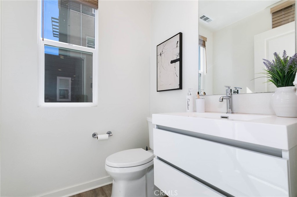 580 Cultivate Irvine, CA 92618 - Photo 26 of 30 a bathroom with a sink toilet and mirror