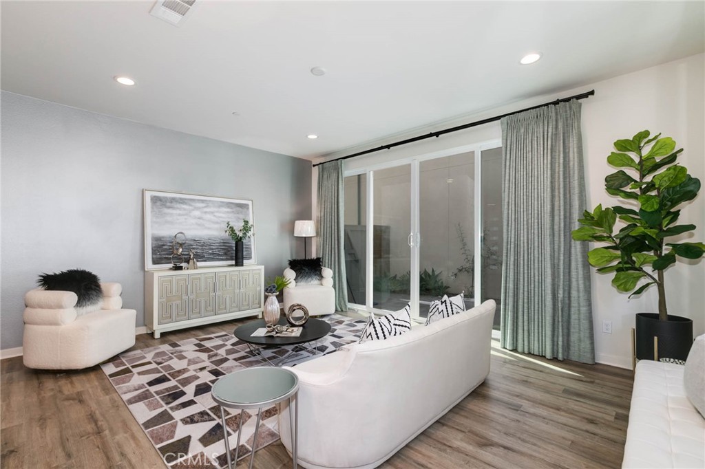 580 Cultivate Irvine, CA 92618 - Photo 7 of 30 a living room with furniture and a potted plant