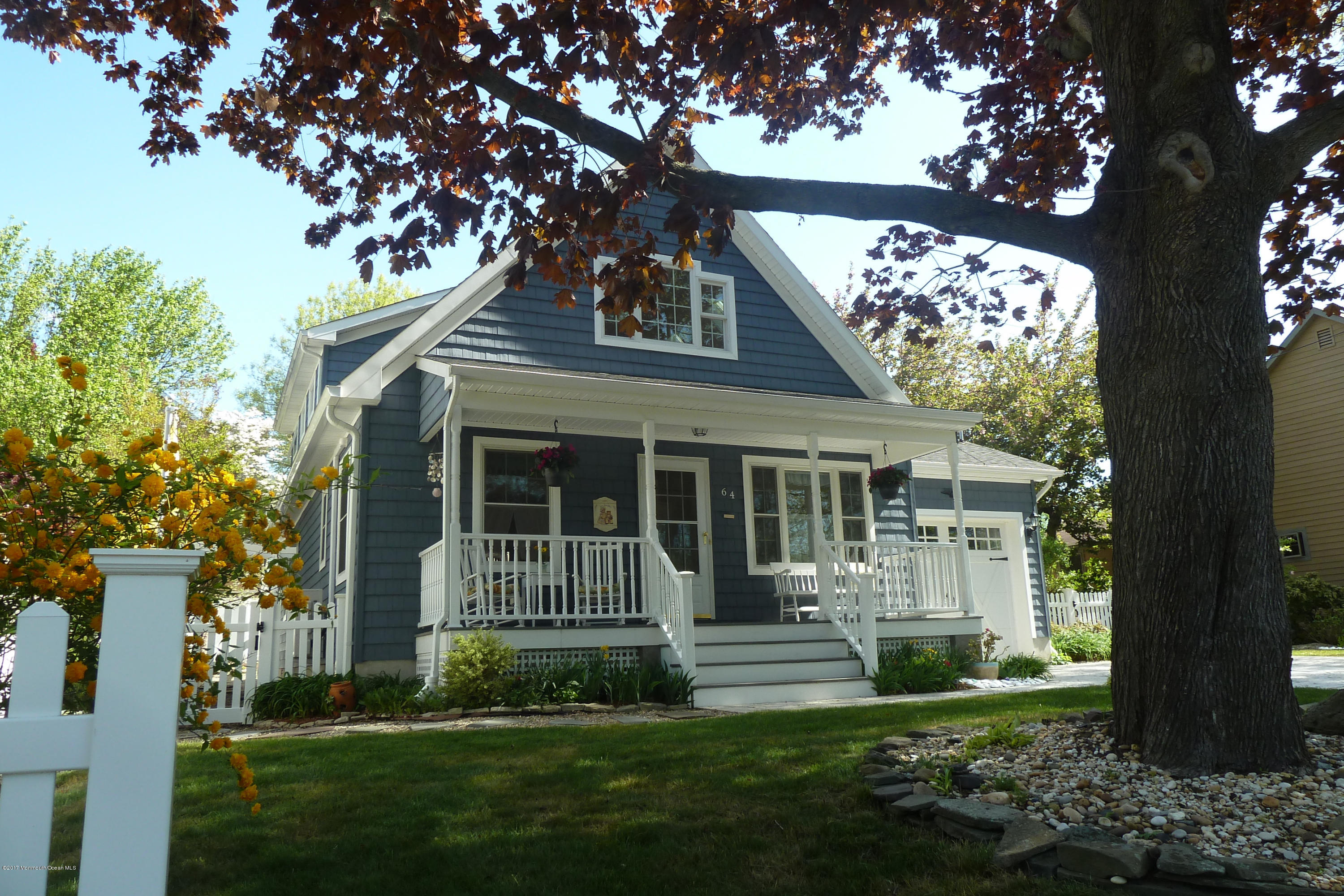 64 Manito Road Manasquan, NJ 08736 - Photo 3 of 26 front view of a house with a yard
