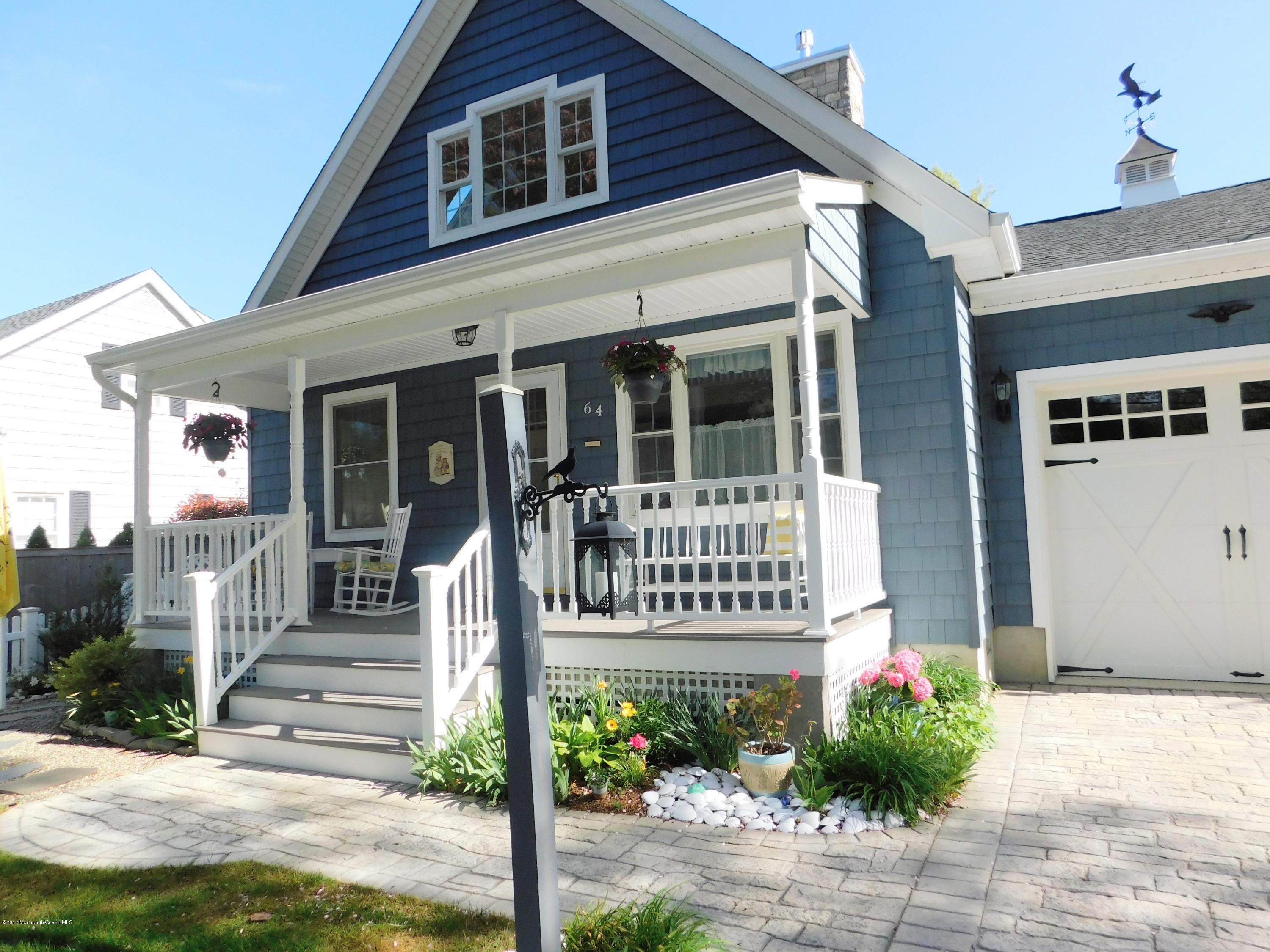 64 Manito Road Manasquan, NJ 08736 - Photo 4 of 26 a front view of a house with a porch