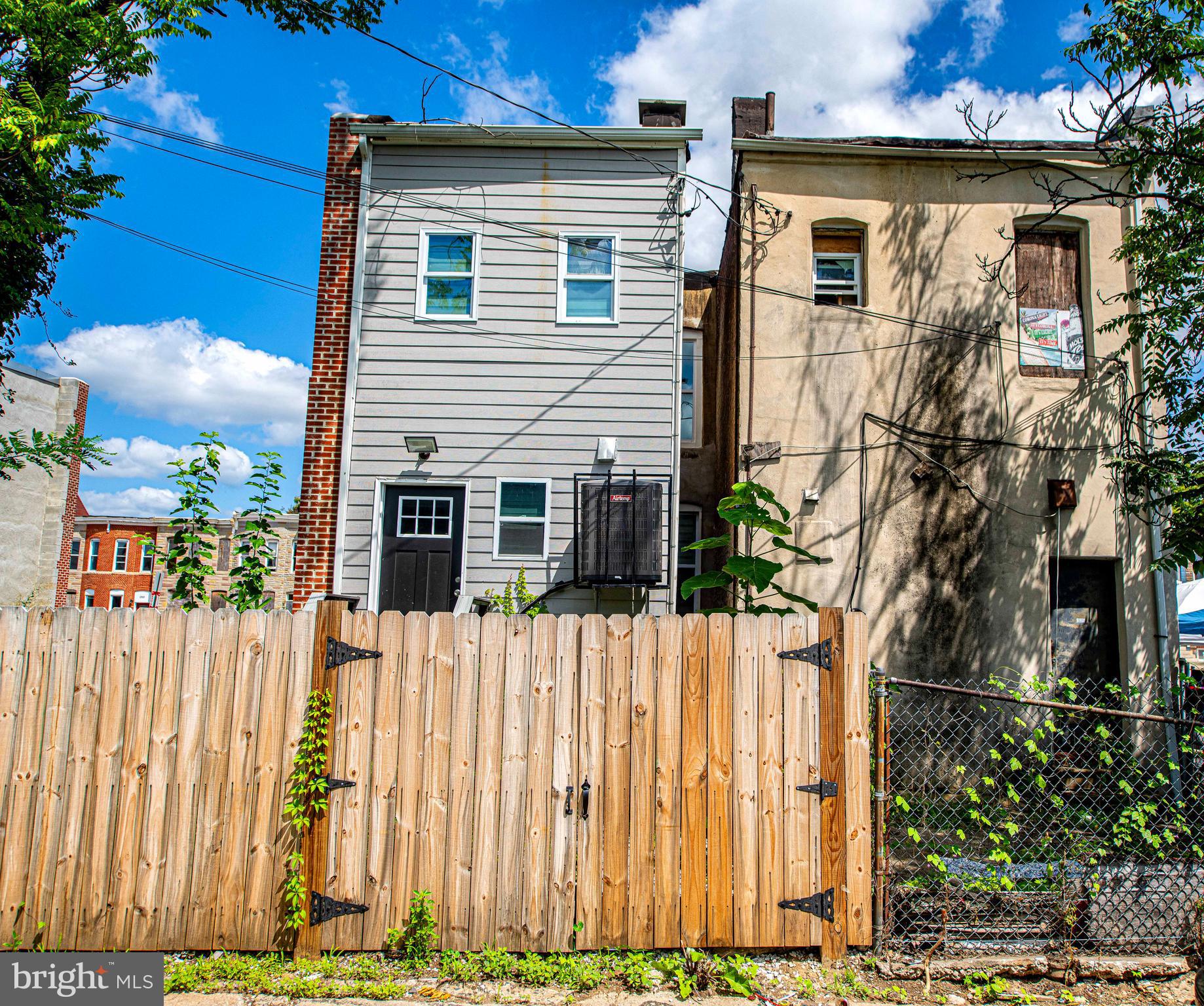 2331 Federal Street Baltimore, MD 21213 - Photo 11 of 15 a front view of a house with a yard