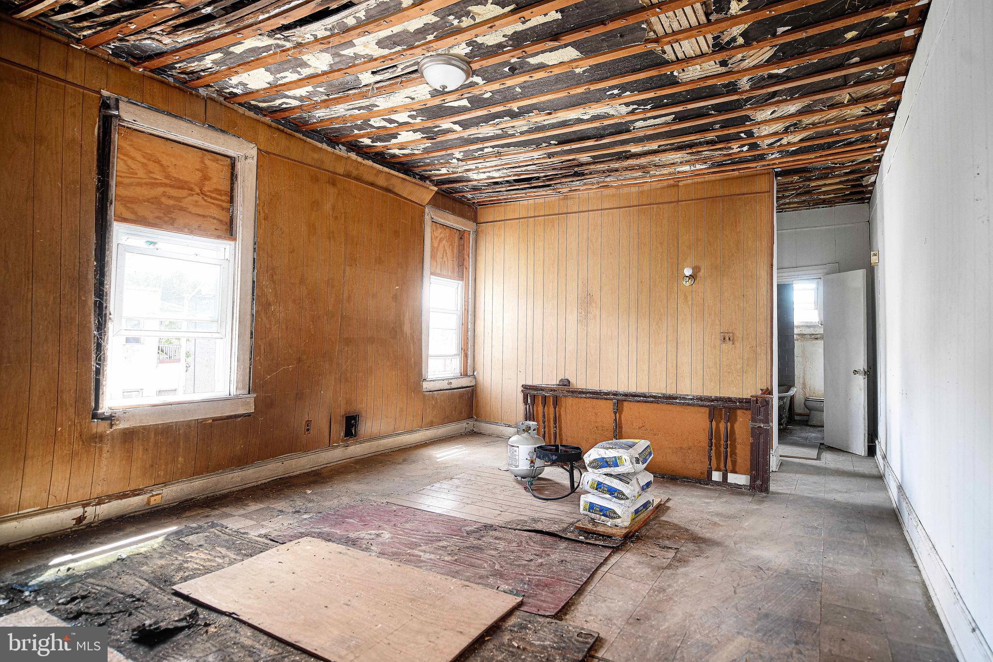 2331 Federal Street Baltimore, MD 21213 - Photo 4 of 15 a room with furniture and a window