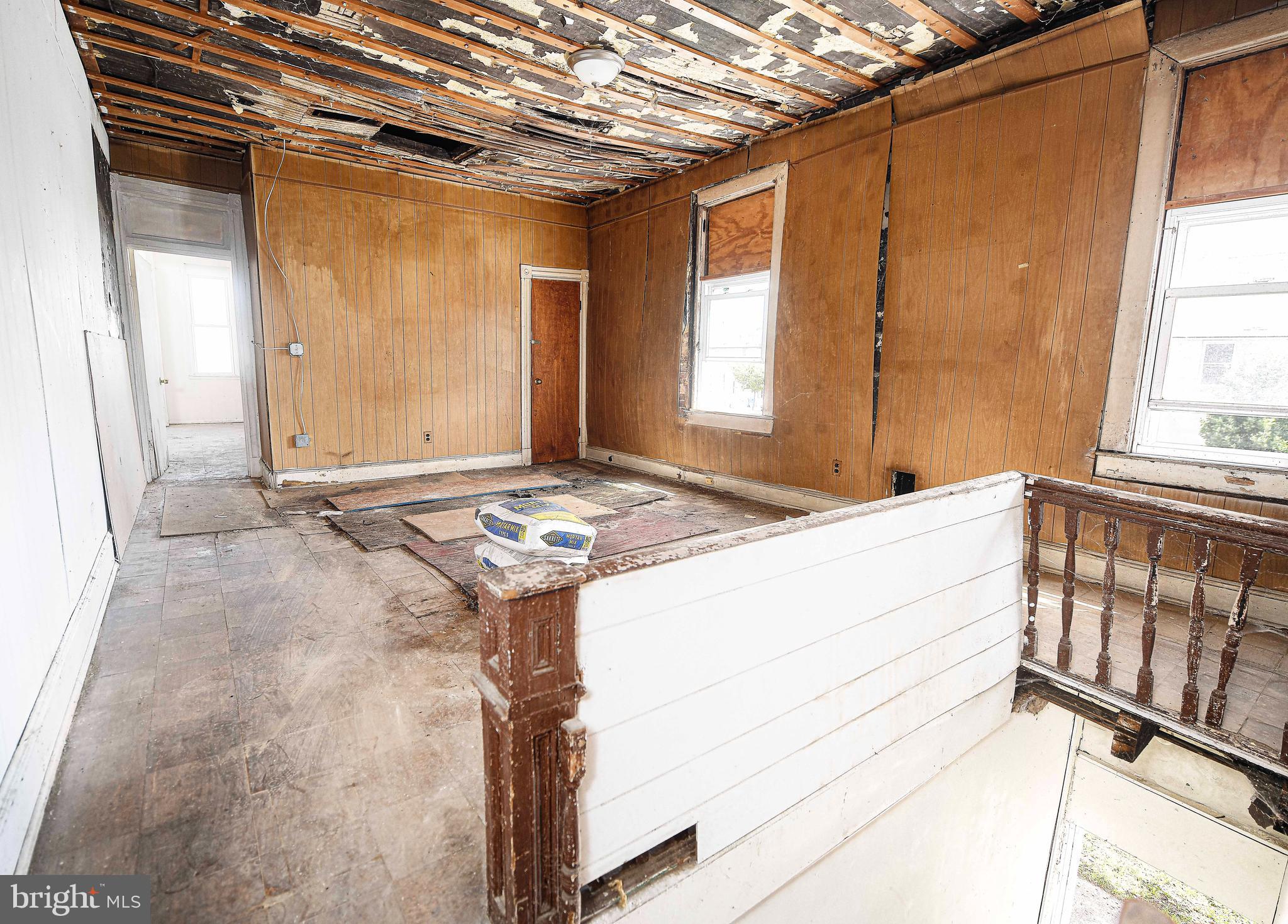 2331 Federal Street Baltimore, MD 21213 - Photo 5 of 15 a bathroom with a granite countertop sink and a mirror